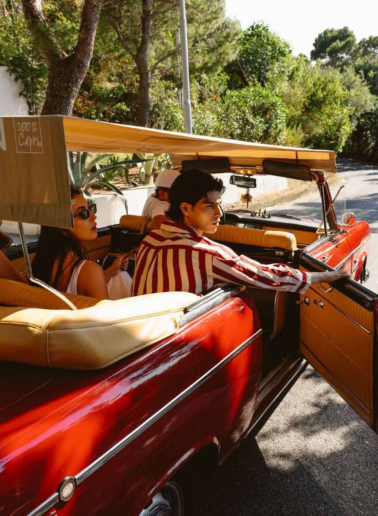 Guests in a vintage convertible