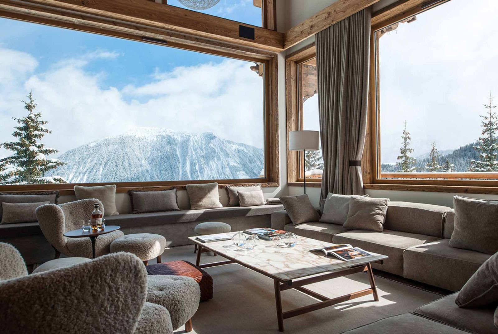 Chalet living room facing snowy peaks