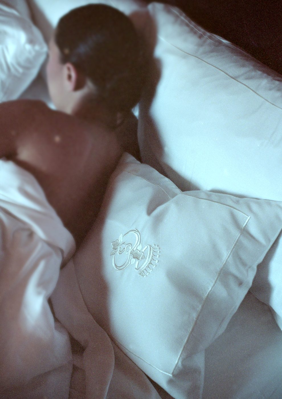 Guest resting on embroidered pillows