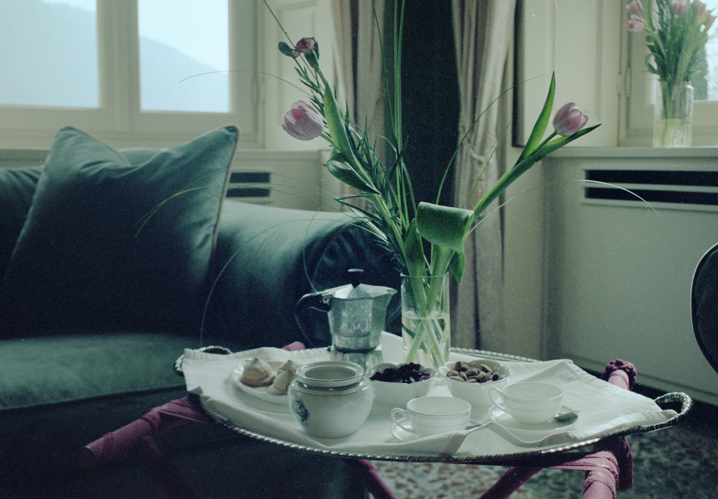 Breakfast tray and tulips in a villa living room